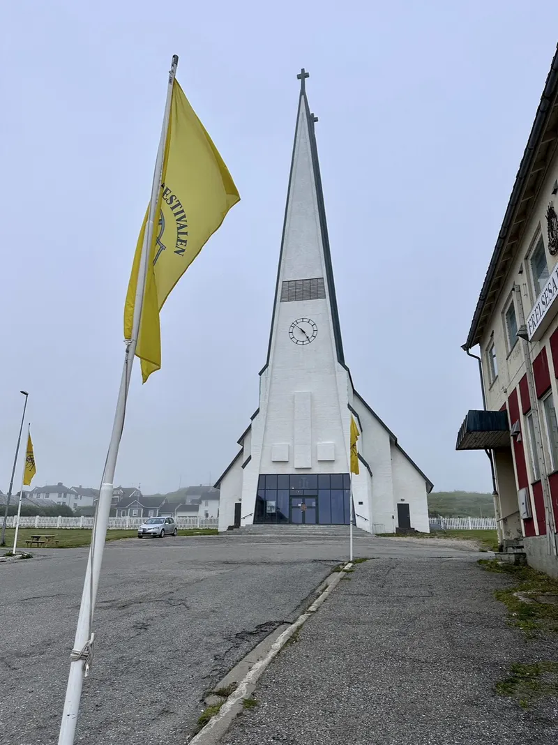 Festival flags by the church in Vardø during the Pomor Festival.